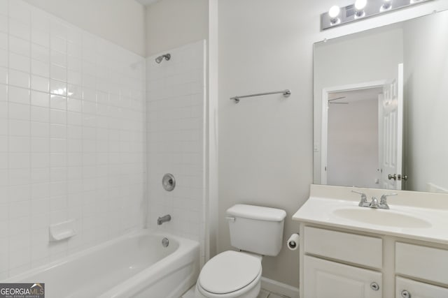 full bathroom featuring vanity, toilet, and tiled shower / bath