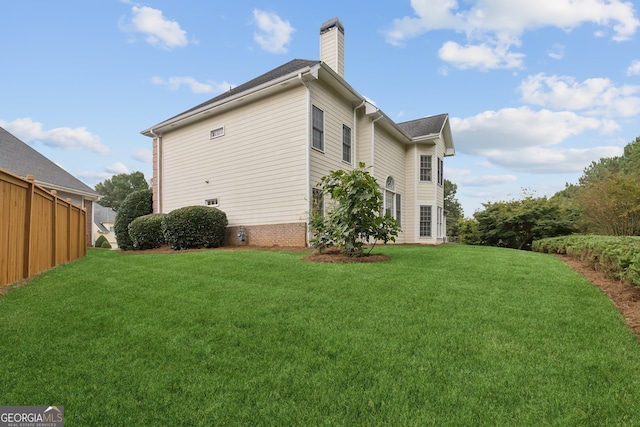 view of property exterior featuring a lawn