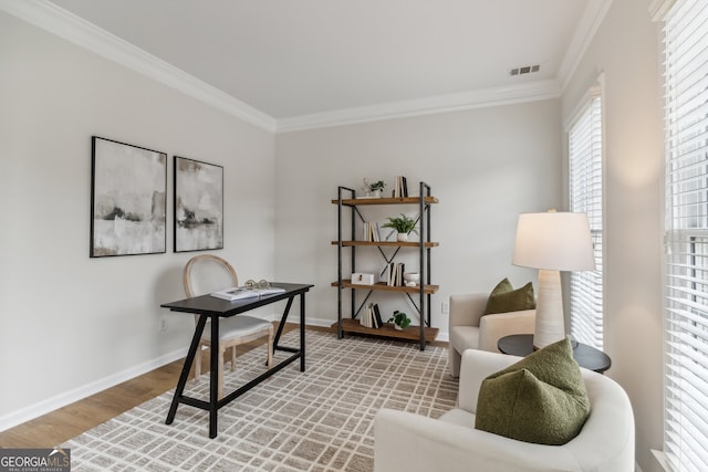 home office with crown molding and hardwood / wood-style flooring