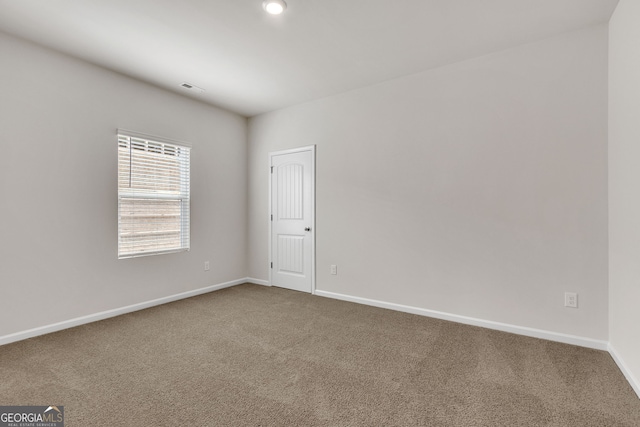 unfurnished room with carpet floors