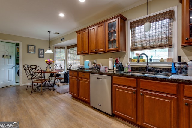 kitchen with hanging light fixtures, dishwasher, crown molding, light hardwood / wood-style flooring, and sink