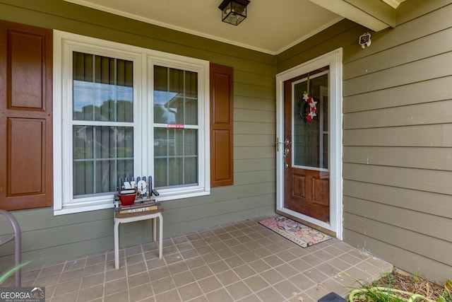 entrance to property with covered porch