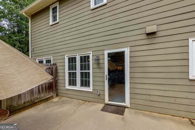 entrance to property featuring a patio