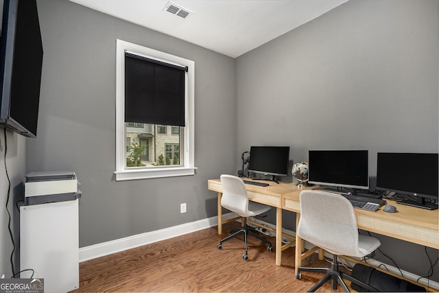 office with wood-type flooring