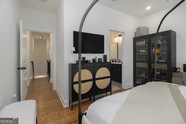 bedroom with light hardwood / wood-style floors