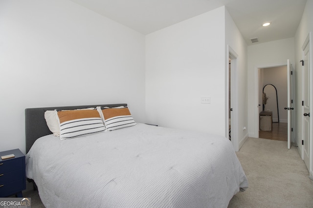 bedroom with light carpet