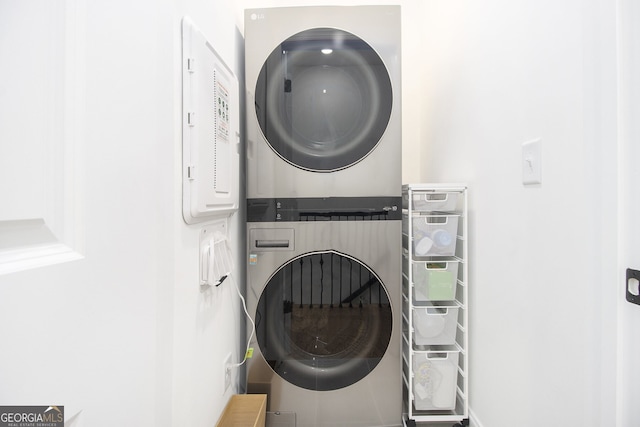 laundry area featuring stacked washing maching and dryer