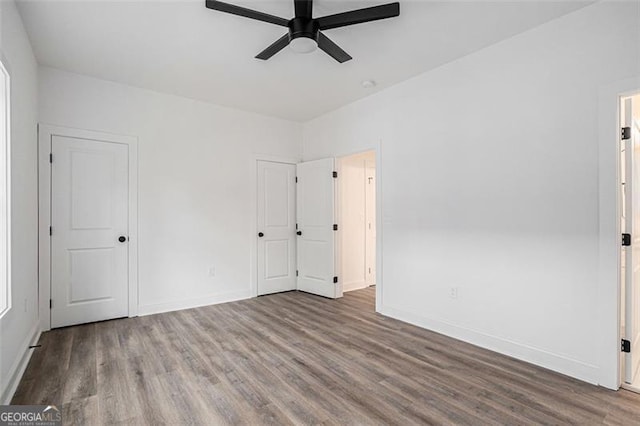 spare room with wood-type flooring and ceiling fan