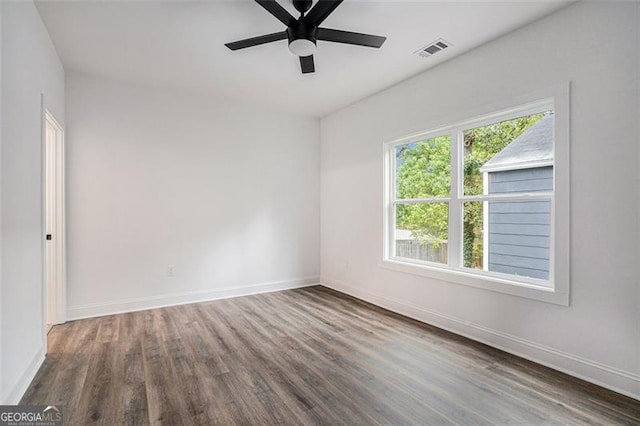 unfurnished room featuring ceiling fan and dark hardwood / wood-style floors