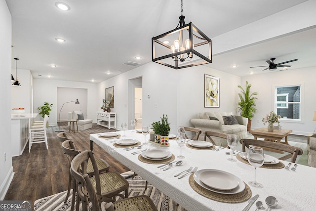 dining room featuring ceiling fan and dark wood-type flooring