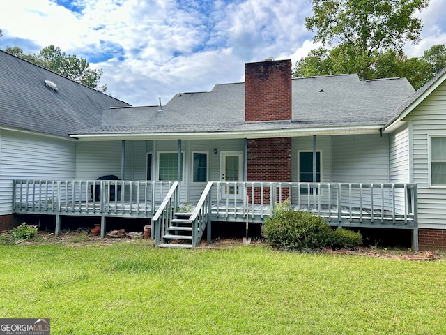 back of house with a lawn and a porch