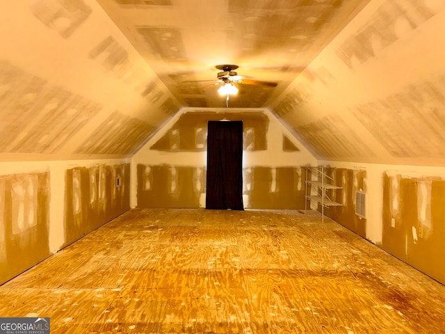 additional living space featuring lofted ceiling and ceiling fan