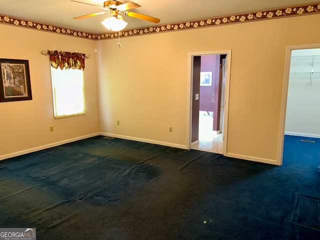 carpeted empty room with ceiling fan