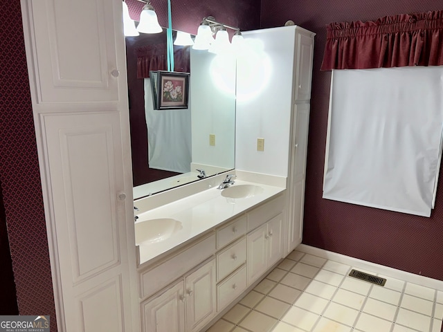 bathroom with tile patterned flooring and vanity