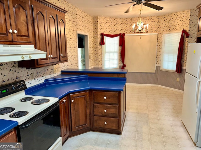 kitchen with ceiling fan with notable chandelier, white appliances, and ventilation hood