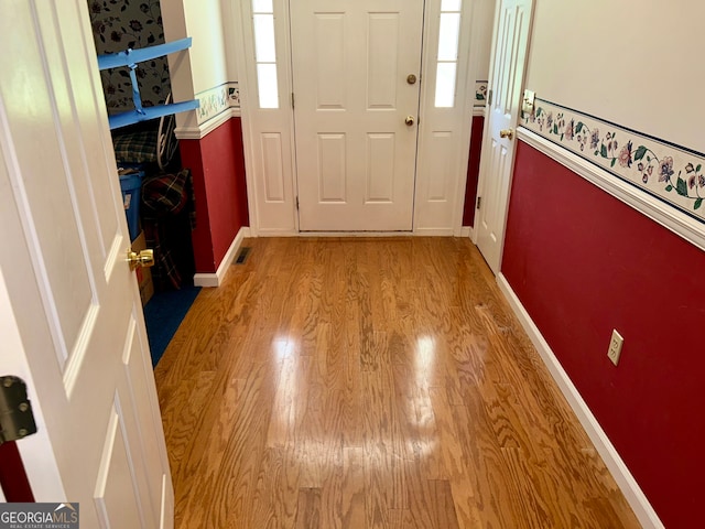 foyer with light wood-type flooring