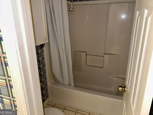 bathroom featuring shower / tub combo and tile patterned floors