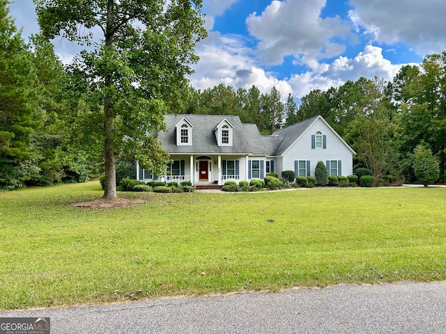 cape cod-style house with a front lawn and covered porch