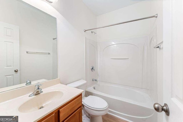 full bathroom with vanity, shower / bath combination, and toilet