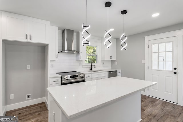 laundry room with hardwood / wood-style flooring and washer hookup