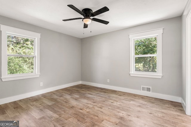 spare room featuring hardwood / wood-style floors