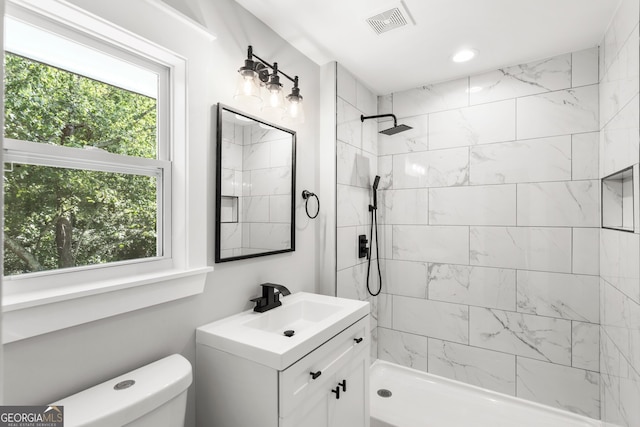 bathroom featuring vanity and a tile shower