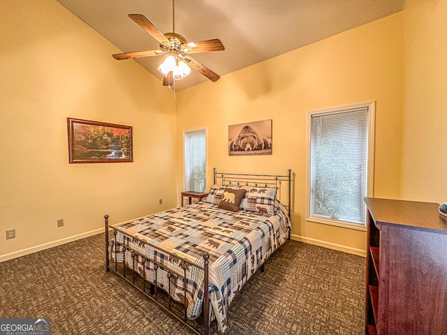 bedroom with dark carpet, multiple windows, high vaulted ceiling, and ceiling fan