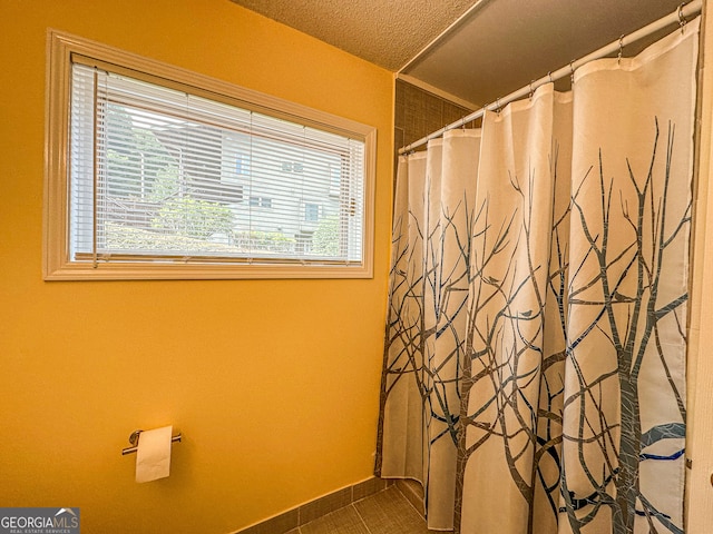 bathroom with a textured ceiling