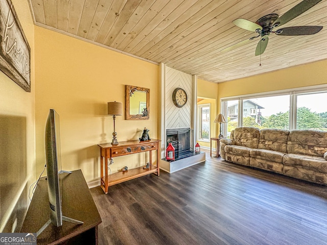 living room featuring wood ceiling, a large fireplace, ceiling fan, ornamental molding, and dark hardwood / wood-style floors