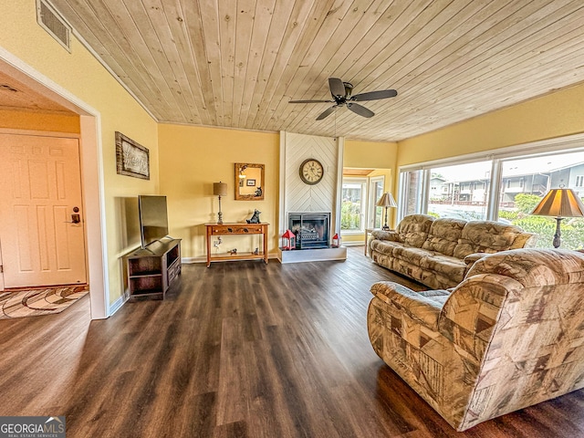 living room featuring a large fireplace, ceiling fan, dark hardwood / wood-style floors, and wooden ceiling