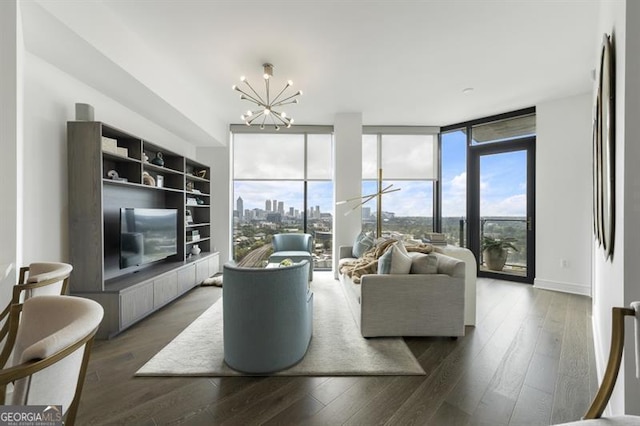 living room featuring a chandelier, dark hardwood / wood-style floors, and floor to ceiling windows