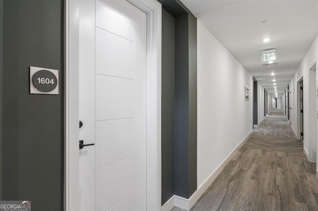 corridor featuring hardwood / wood-style floors