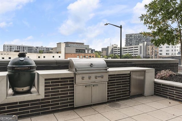 view of patio with grilling area and exterior kitchen