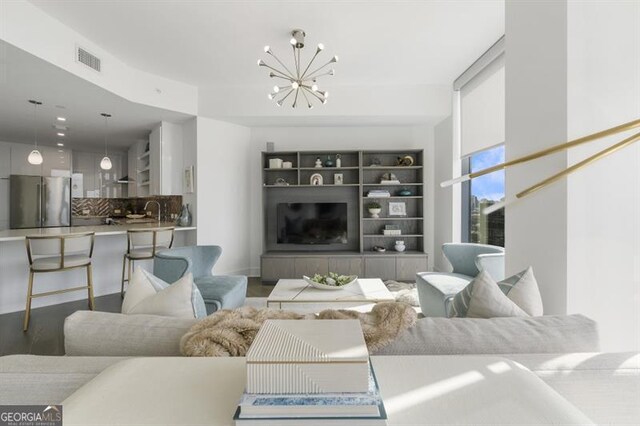 living room with an inviting chandelier