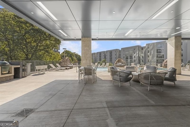 view of patio / terrace featuring a community pool