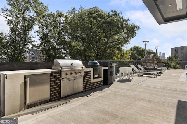 view of patio featuring area for grilling and an outdoor kitchen