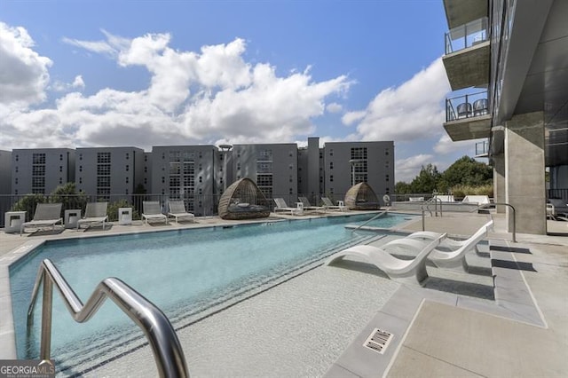 view of swimming pool featuring a patio