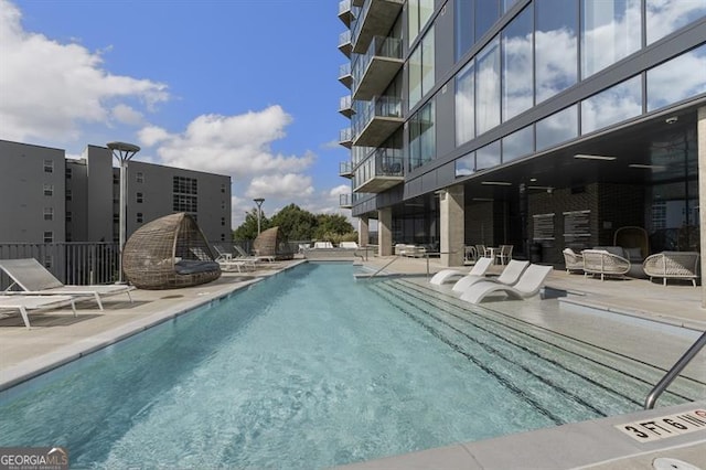 view of pool featuring a patio