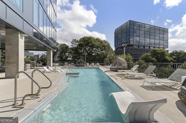 view of pool featuring a patio