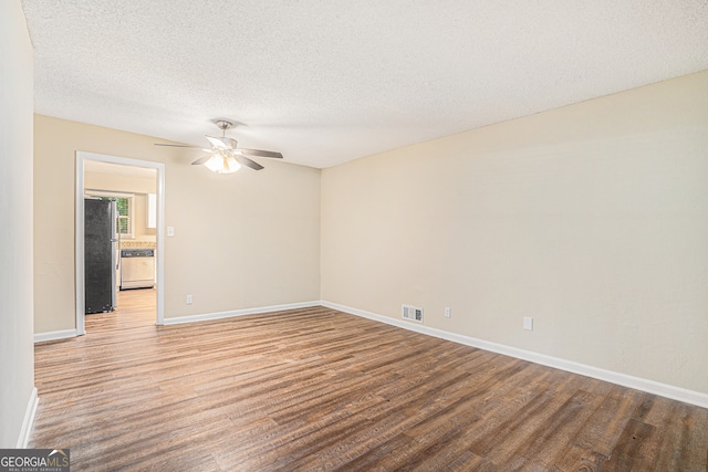 unfurnished room with ceiling fan, a textured ceiling, and wood-type flooring