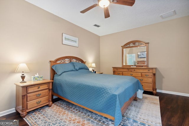 bedroom featuring ceiling fan, a textured ceiling, and hardwood / wood-style floors