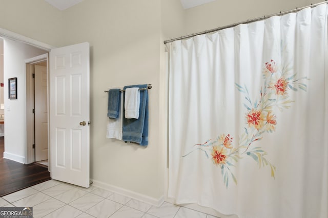 bathroom with wood-type flooring