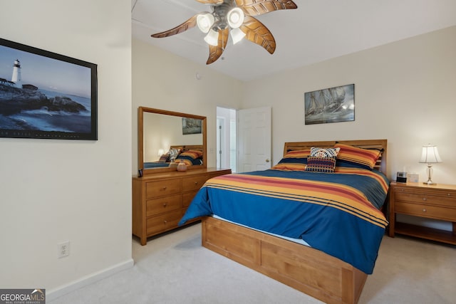 bedroom with ceiling fan and light colored carpet