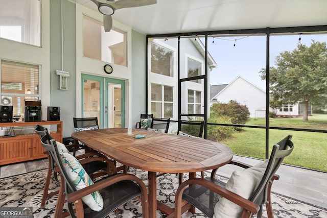 sunroom featuring ceiling fan