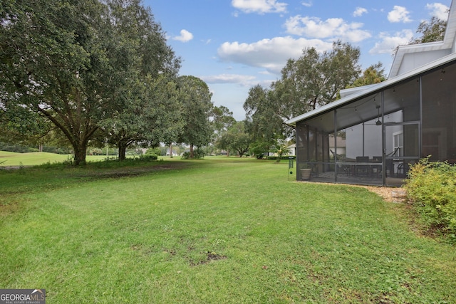 view of yard featuring a sunroom