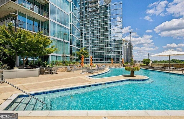 view of pool featuring a patio