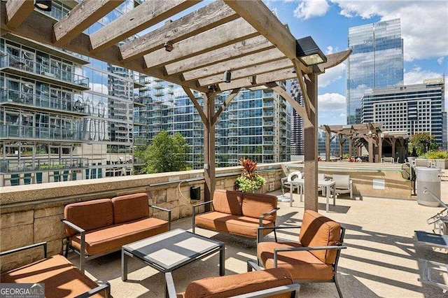 view of patio / terrace with a pergola and an outdoor living space