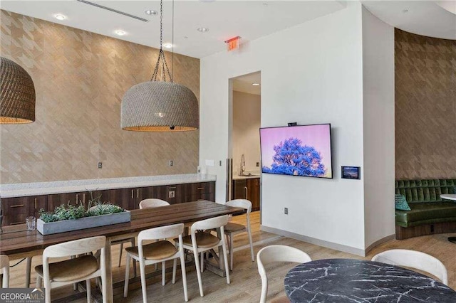 dining area with light hardwood / wood-style floors