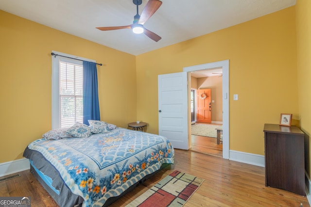 bedroom featuring ceiling fan and wood-type flooring