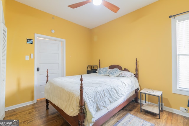 bedroom with ceiling fan and hardwood / wood-style floors